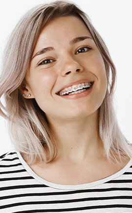 Teenage girl with braces smiling